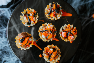 Phyllo Shells with Reese's cups and Snickers candy. 